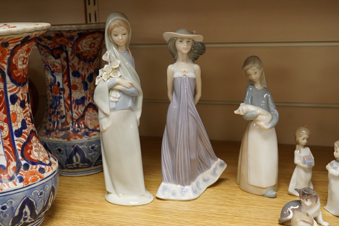 A group of twelve Lladro figures/animals, tallest 23cm